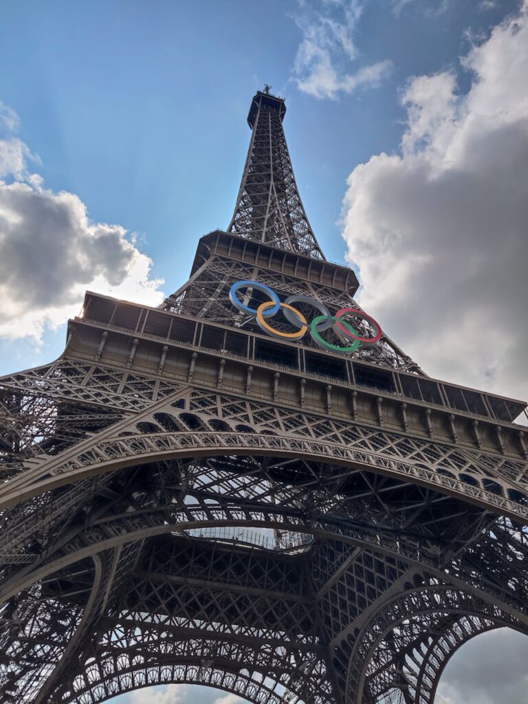 The eiffel tower with the olympic logo on it